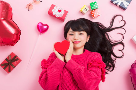 A woman surrounded by giftsの写真素材