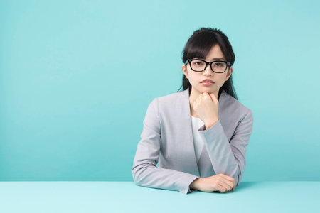 A woman smiling at a deskの写真素材