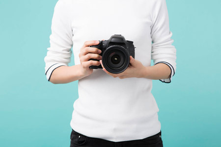 A camera held by woman's handsの写真素材