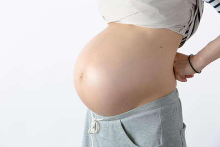 Pregnant and Inflated Woman's Stomach