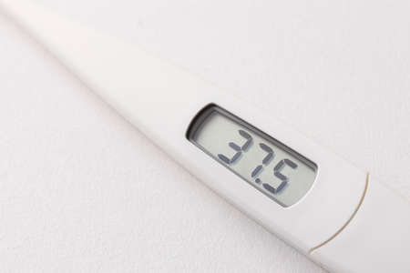 Digital thermometer that displays a slight heat of 37.5 degreesの写真素材