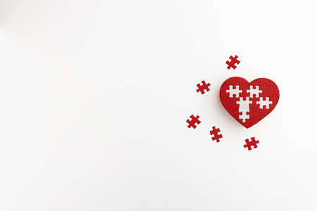 a heart-shaped puzzle placed on a white backgroundの写真素材