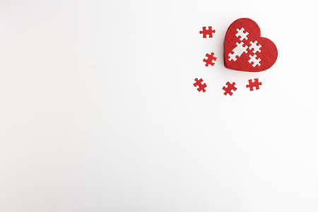 a heart-shaped puzzle placed on a white backgroundの写真素材