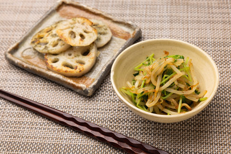 soybean sprouts salad in a bowl with grilled lotus rootsの写真素材