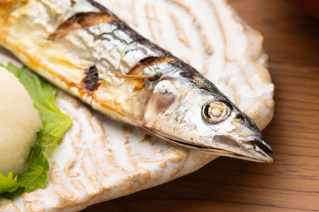 Pacific saury fish on the wooden table