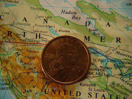 US dollar coin on map of United Statesの写真素材