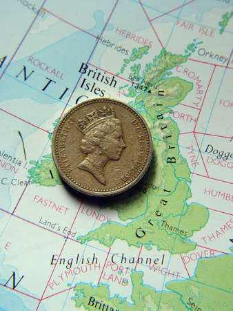 British one pound coin on map of Great Britainの写真素材