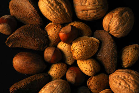 Assorted nuts on black backgroundの写真素材
