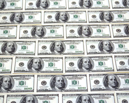 background image of hundred dollar bills lined up end to end