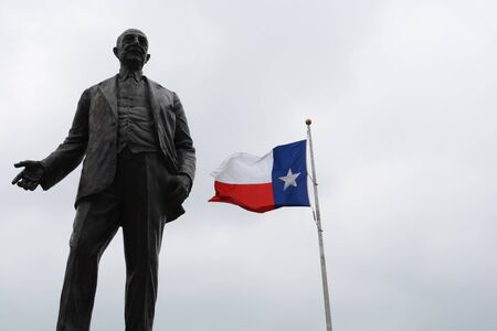 George Dealey Statue with Texas Flagの写真素材