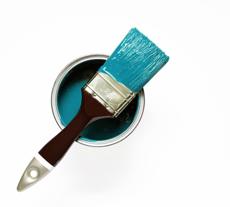 Turquise painted brush on a paint bucketの写真素材