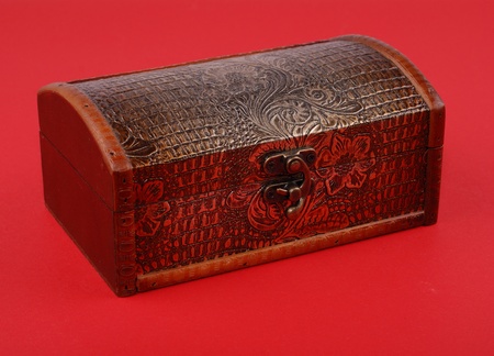 wooden casket on red background.の写真素材