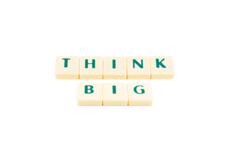 Letters forming the words THINK BIG on a white backgroundの写真素材