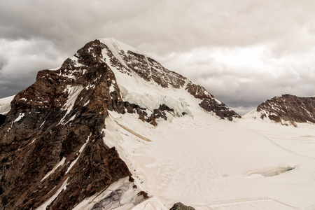 Snow capped peak of the Monch (4107m - 13474ft) in the Bernese Alps, seen from Jungfraujoch....