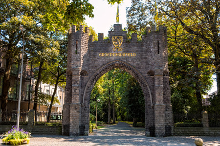 Groeningegate, a triumphal arch (1906) at the former Groeningefield where the Battle of the Golden Spurs (Guldensporenslag) was fought July 11 1302. Kortrijk, Flanders, Belgiumのeditorial素材