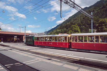 Wilderswil, Bernese Oberland, Switzerland - AUGUST 5, 2017 : retro passenger train arrives in the...