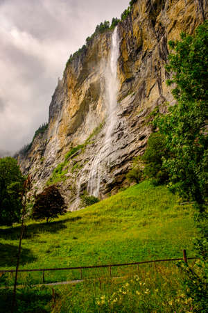 Famous Staubbach Falls in the Lauterbrunnen valley, Jungfrau region, Bernese Oberland, Switzerland, overcast day in summer. Portrait orientationの写真素材