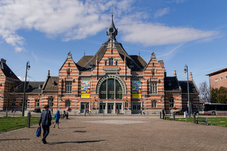 Schaarbeek, Brussels Capital Region, Belgium - March 8 2019: Facade of the Schaarbeek (fr: Schaerbeek) railway station and the sqare Pricess Elisabeth in front of the buildingのeditorial素材