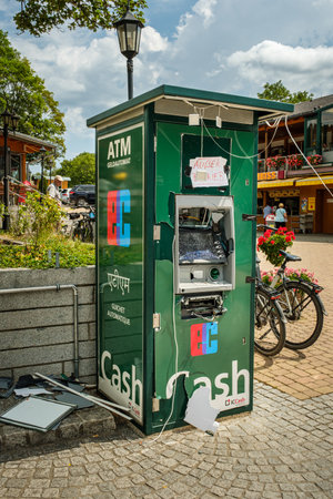 Titisee-Neustadt, Baden-WÃ¼rttemberg, Germany - July 28 2020: exploded and destroyed cash dispenser after a robbery. German note saying "Ausser betrieb" (EN: "out of service")のeditorial素材