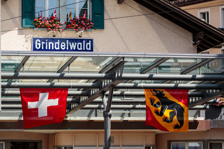Grindelwald, Bernese Oberland, Switzerland - August 1 2019: the flags of Switzerland and the canton...