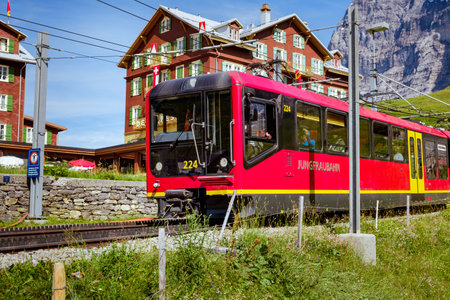 Kleine Scheidegg, Bernese Oberland, Switzerland - August 1 2019: close up of the frond of red Jungfraubahn train returning from Jungfraujoch (Top of Europe) in summerのeditorial素材