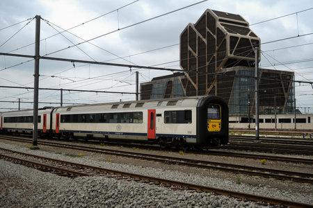Hasselt, Flanders, Belgium - July 17 2020: Electrical train class MS 96 of the Belgian railways (NMBS / SNCB) near the Hasselt railway station. The courthouse in the backgroundのeditorial素材