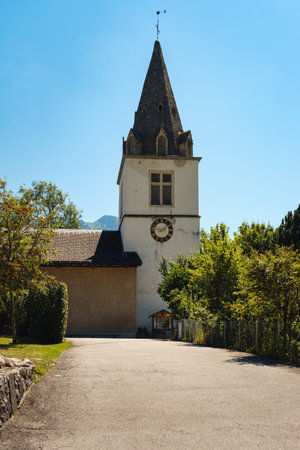 Picturesque white parish church on bright sunny day in summer, Cergnat, Ormont-Dessous, Vaud canton, Switzerlandの写真素材