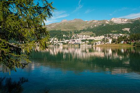 Scenic view on the St. Moritz mountain lake with the alpine resort on the other side on a bright summer day. Canton Grisons, Switzerlandの写真素材
