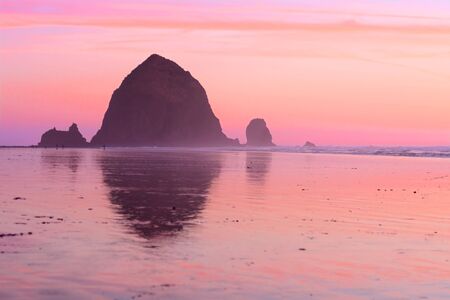 Beautiful sunset at Haystack Rock, Cannon Beach, Oregonの写真素材