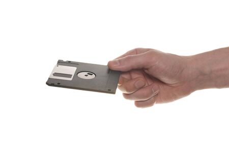 hand with a floppy disk isolated on white backgroundの写真素材