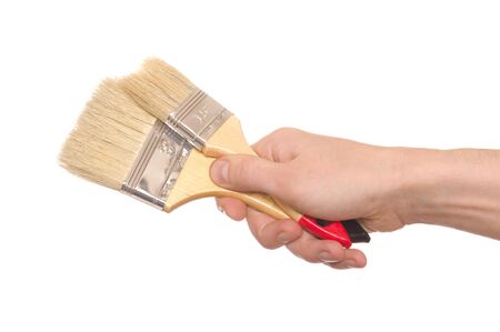 hand with a brush isolated on white background の写真素材