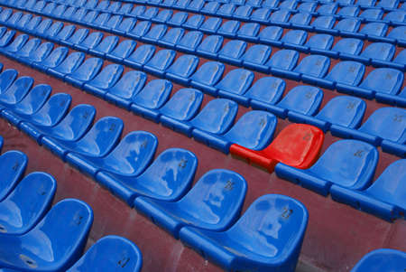 Dark blue rows of seats on the arena of sporting stadium                   