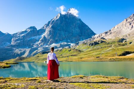 Young girl dancing in the mountainsの写真素材