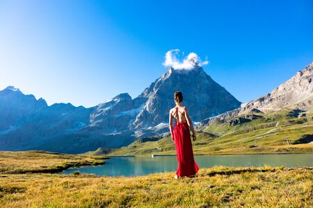 Young girl dancing in the mountainsの写真素材
