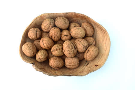 Walnuts in a wooden vase
