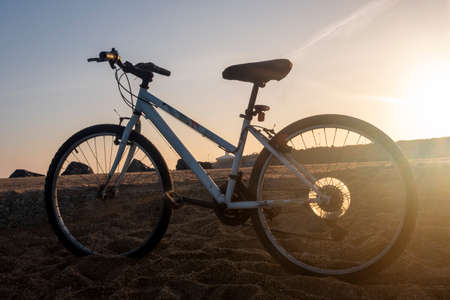 bike ride on the beach at sunrise