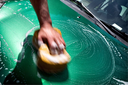 car wash with a sponge and soapの写真素材