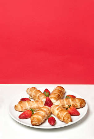 cannoli with strawberries on a white backgroundの写真素材