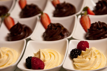 fruit mousse and chocolate on a trayの写真素材