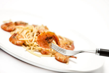 spaghetti with tomato sauce and shrimpsの写真素材