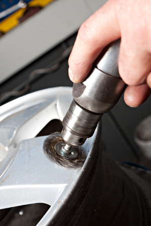 Mechanical repairs a tire in the garage.の写真素材