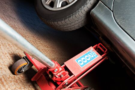 cars lifted off the ground to be repairedの写真素材