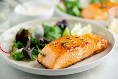 Grilled salmon fillet and fresh vegetable salad. Mediterranean diet.