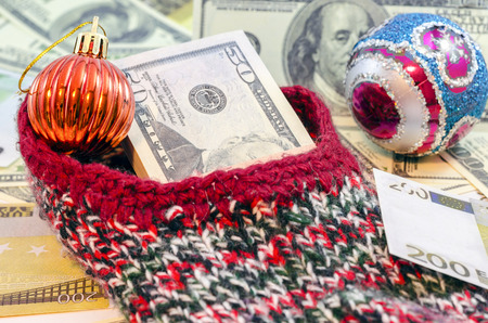 Christmas gift to wear a lot of different denominations of banknotesの写真素材