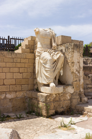 Partially preserved statue of white marble in the ruined city of Caesarea in Israel.の写真素材