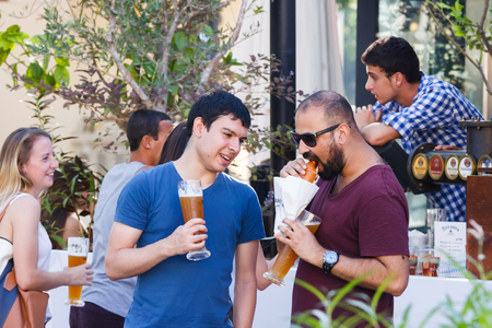 Tel Aviv, Israel, September 16, 2016: The visitors to the annual festival of beer standing and talk in Tel Aviv, Israelのeditorial素材