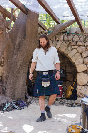 Jerusalem, Israel, October 03, 2016: Member of the annual festival of "Knights of Jerusalem", dressed in a Scottish kilt performs a dance in Jerusalem, Israelのeditorial素材