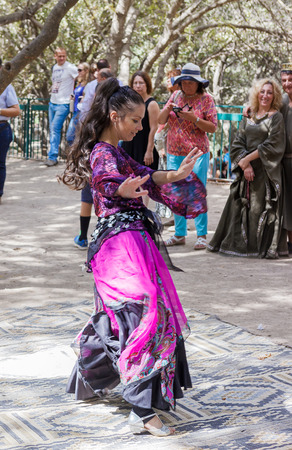 Jerusalem, Israel, October 03, 2016: Members of the annual festival of "Knights of Jerusalem" dressed as a dancer is dancing oriental dance in Jerusalem, Israelのeditorial素材