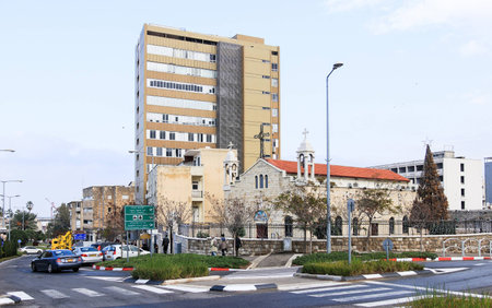 St. Elias Cathedral of the Melkite Catholic adjacent to the new buildings in Haifa's downtown, Israelの写真素材