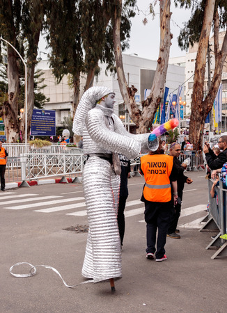 Nahariyya, Israel, March 10, 2017: Participants at the traditional annual Ñarnival parade "Adloyada" dressed in robots are walking along the street in Nahariyya, Israelのeditorial素材